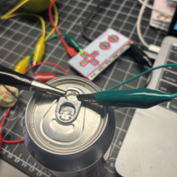 I connected the ground wire and the top arrows wire to the diet pepsi I had.